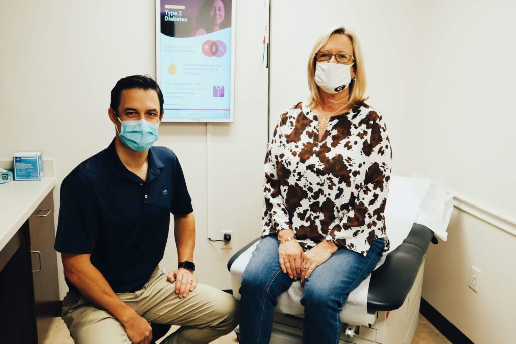 Dr. Franky Davis during an orthopedic consultation with a patient in Moultrie, GA